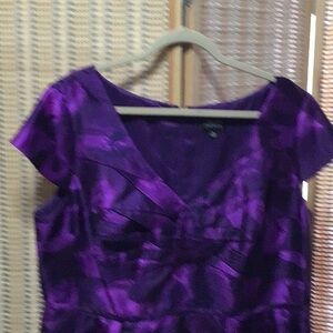 New gorgeous dress. Never worn shades of purple and black floral